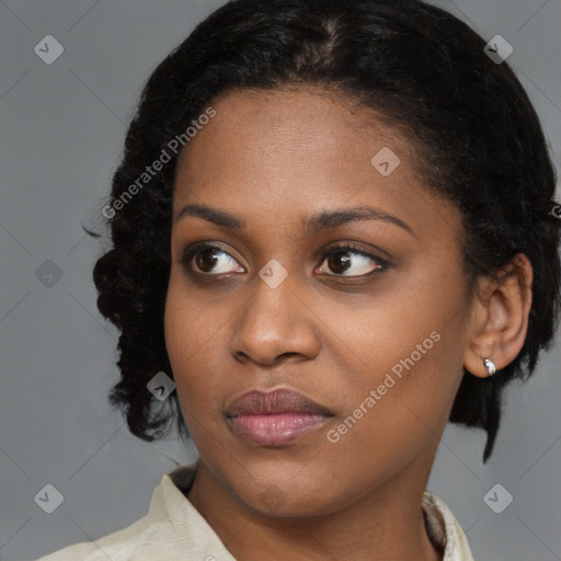 Joyful black young-adult female with medium  brown hair and brown eyes