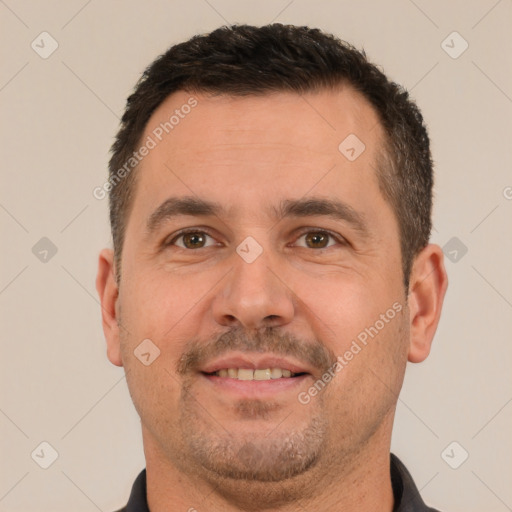 Joyful white adult male with short  brown hair and brown eyes