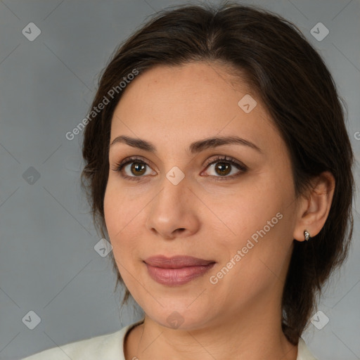 Joyful white adult female with medium  brown hair and brown eyes