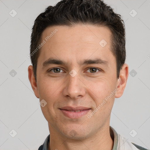 Joyful white adult male with short  brown hair and brown eyes