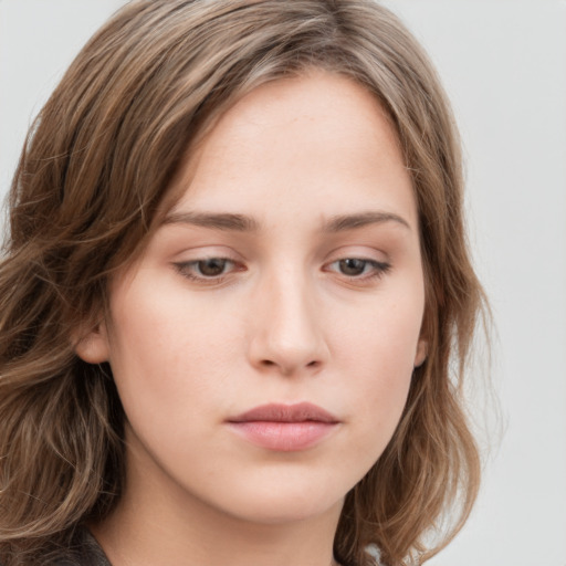 Neutral white young-adult female with long  brown hair and grey eyes