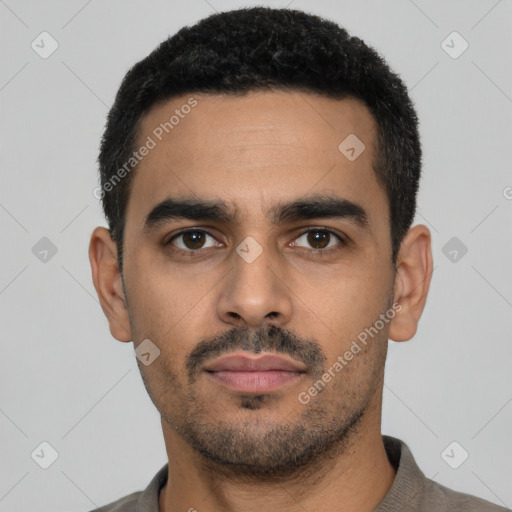 Neutral latino young-adult male with short  black hair and brown eyes