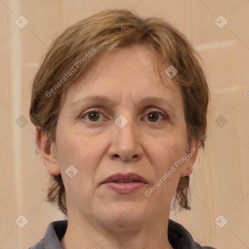 Joyful white adult female with medium  brown hair and brown eyes