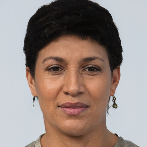 Joyful latino adult female with short  black hair and brown eyes