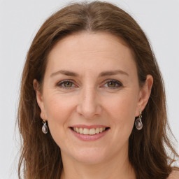 Joyful white young-adult female with long  brown hair and green eyes