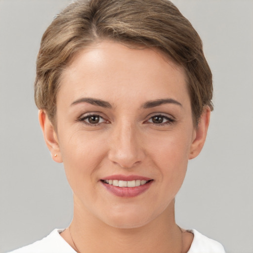 Joyful white young-adult female with short  brown hair and brown eyes