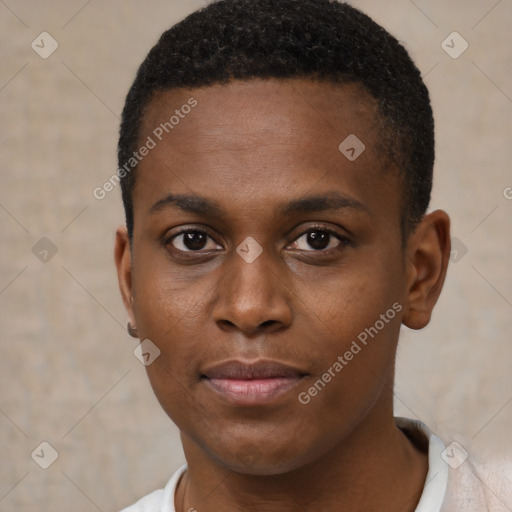 Joyful black young-adult male with short  brown hair and brown eyes