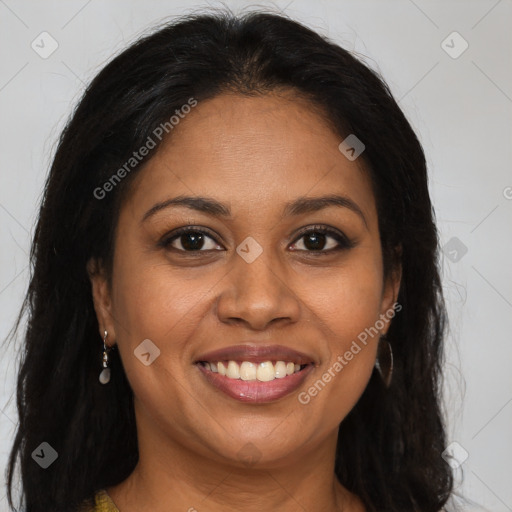 Joyful black young-adult female with long  brown hair and brown eyes