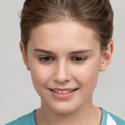 Joyful white child female with short  brown hair and grey eyes