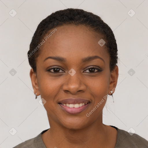 Joyful black young-adult female with short  black hair and brown eyes