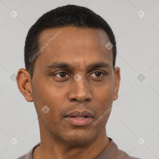 Neutral latino adult male with short  black hair and brown eyes