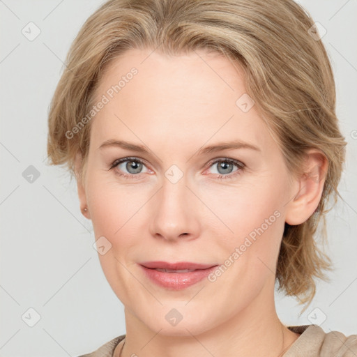 Joyful white young-adult female with medium  brown hair and blue eyes