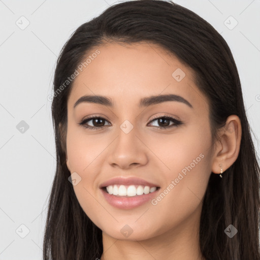 Joyful white young-adult female with long  brown hair and brown eyes