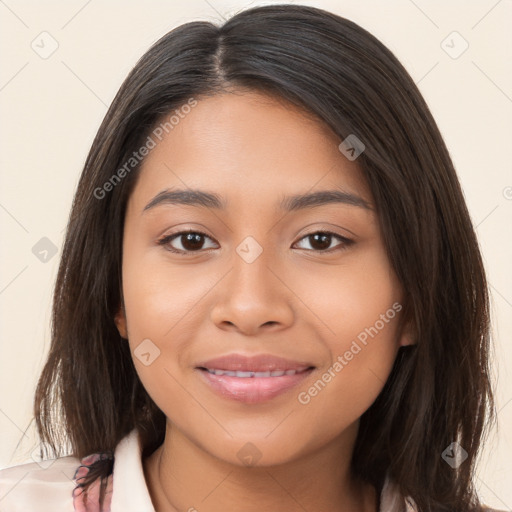 Joyful latino young-adult female with long  brown hair and brown eyes