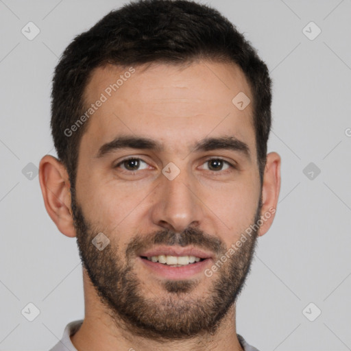 Joyful white young-adult male with short  black hair and brown eyes