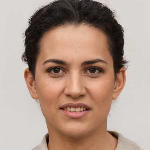 Joyful white young-adult female with short  brown hair and brown eyes