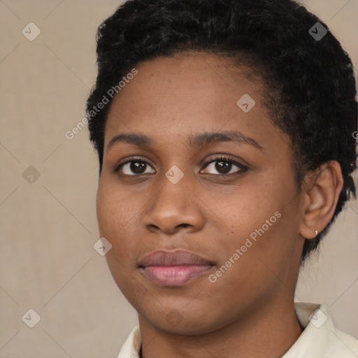 Joyful black young-adult female with short  brown hair and brown eyes