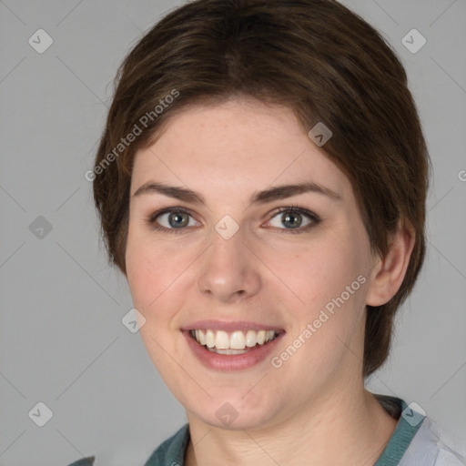 Joyful white young-adult female with medium  brown hair and green eyes