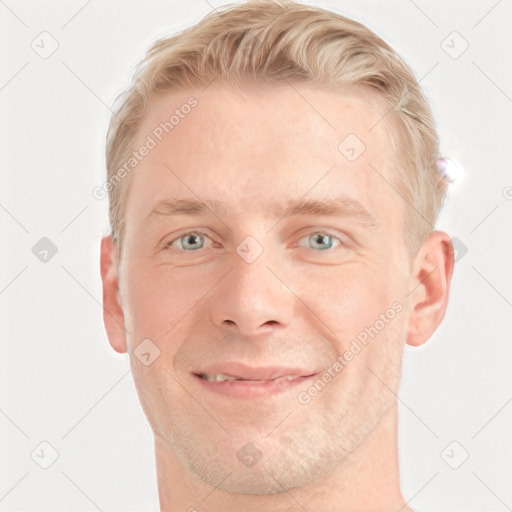 Joyful white adult male with short  brown hair and blue eyes