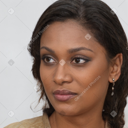 Neutral black young-adult female with long  brown hair and brown eyes