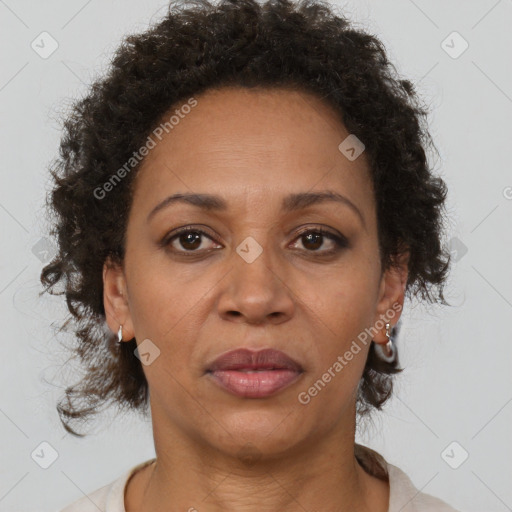 Joyful black adult female with short  brown hair and brown eyes