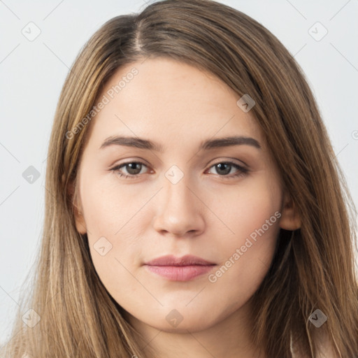 Neutral white young-adult female with long  brown hair and brown eyes