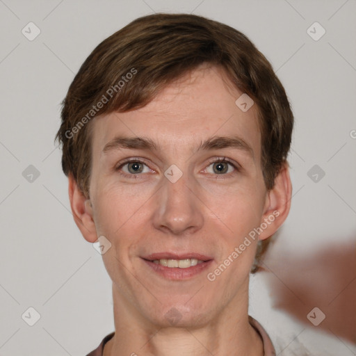 Joyful white adult male with short  brown hair and grey eyes