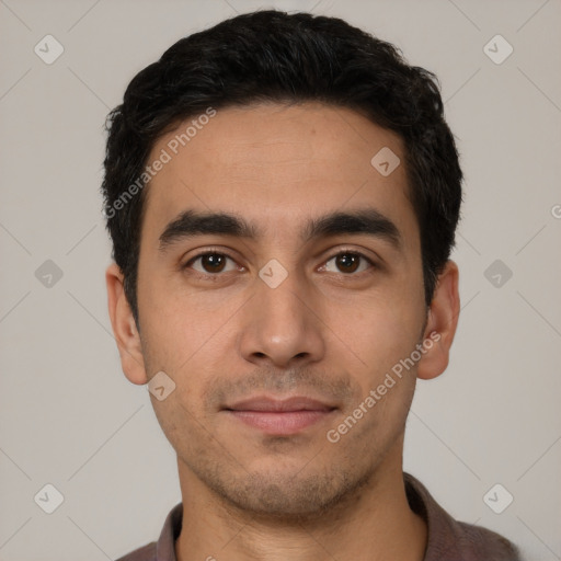 Joyful white young-adult male with short  black hair and brown eyes