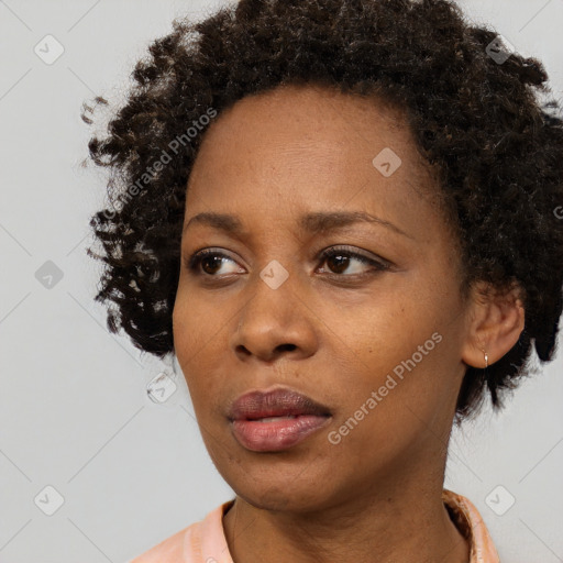 Neutral black young-adult female with short  brown hair and brown eyes