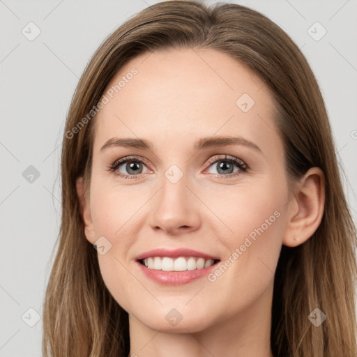 Joyful white young-adult female with long  brown hair and grey eyes