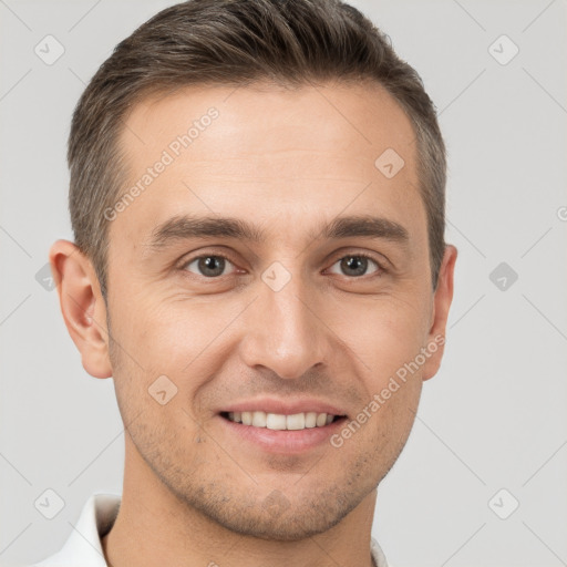 Joyful white young-adult male with short  brown hair and brown eyes