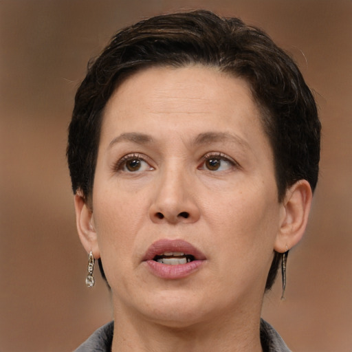 Joyful white adult female with medium  brown hair and brown eyes