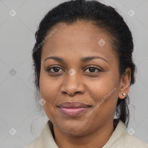 Joyful latino adult female with long  brown hair and brown eyes