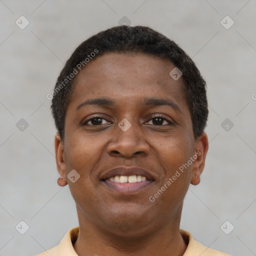 Joyful black young-adult female with short  brown hair and brown eyes