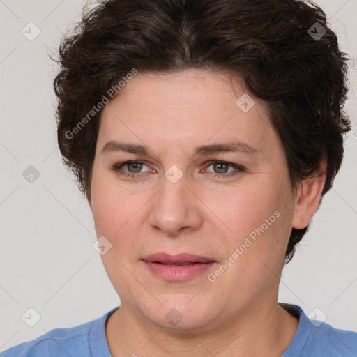 Joyful white adult female with short  brown hair and green eyes