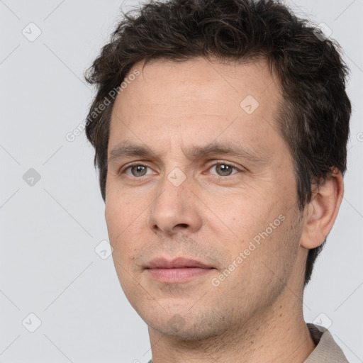 Neutral white adult male with short  brown hair and brown eyes