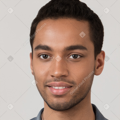 Joyful black young-adult male with short  brown hair and brown eyes