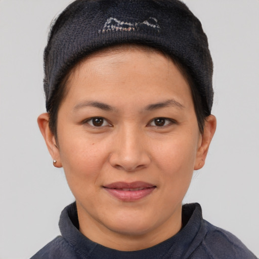Joyful asian young-adult female with short  brown hair and brown eyes