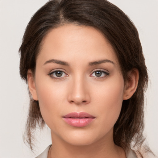 Neutral white young-adult female with medium  brown hair and brown eyes