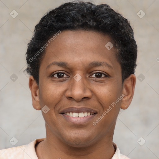 Joyful latino young-adult male with short  brown hair and brown eyes