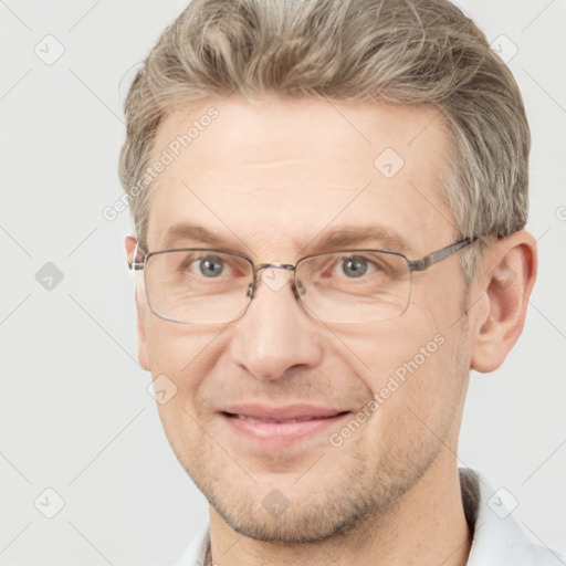 Joyful white adult male with short  brown hair and grey eyes