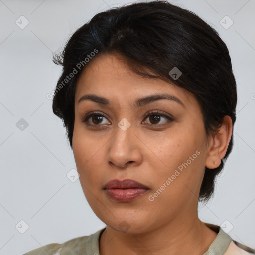 Joyful latino young-adult female with medium  brown hair and brown eyes