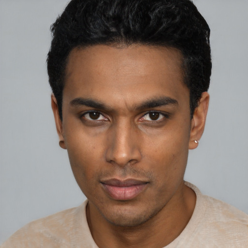 Neutral latino young-adult male with short  black hair and brown eyes