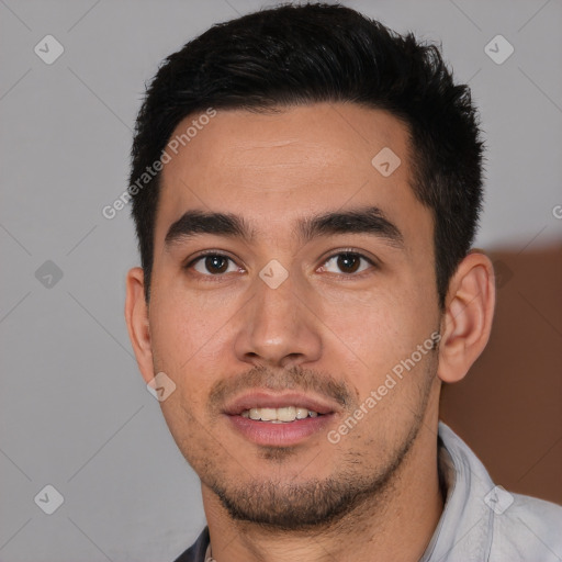 Joyful white young-adult male with short  black hair and brown eyes