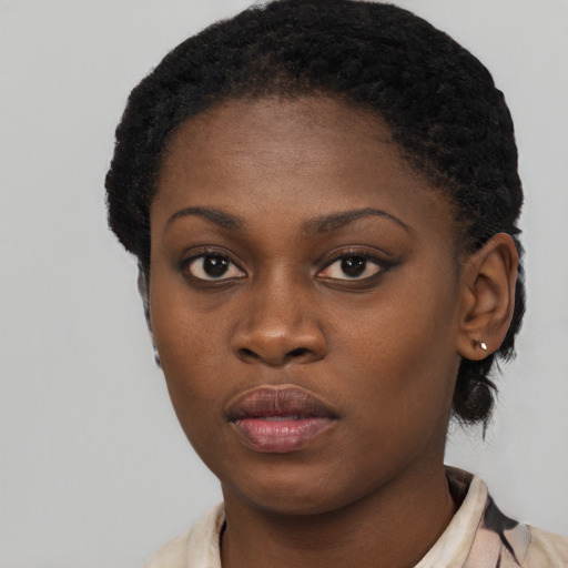 Neutral black young-adult female with short  brown hair and brown eyes