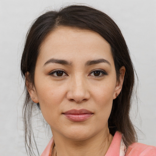 Joyful asian young-adult female with medium  brown hair and brown eyes