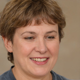 Joyful white adult female with short  brown hair and grey eyes