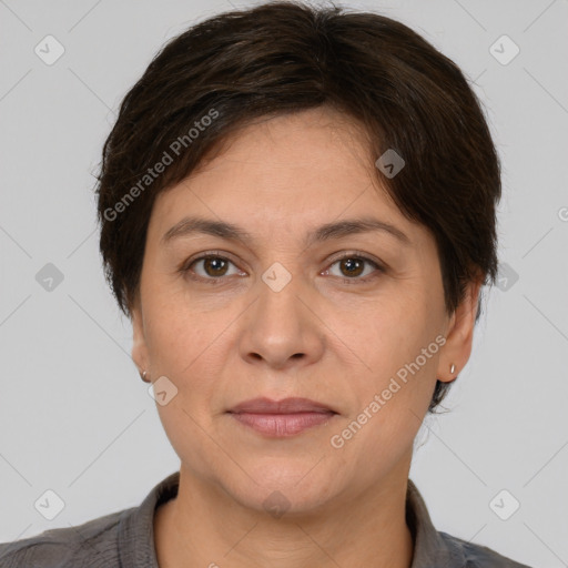 Joyful white adult female with short  brown hair and brown eyes