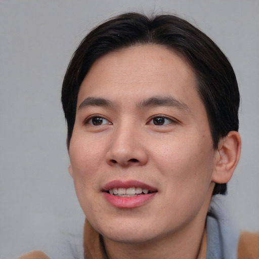Joyful asian young-adult male with short  brown hair and brown eyes