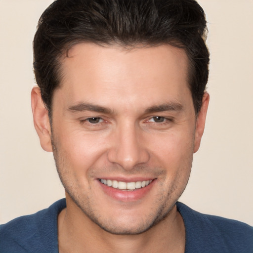 Joyful white young-adult male with short  brown hair and brown eyes